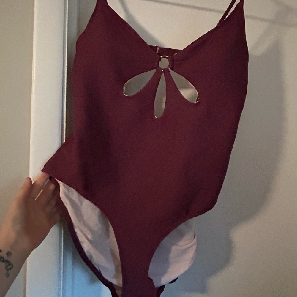 NWT Time and true purple one piece with cut outs